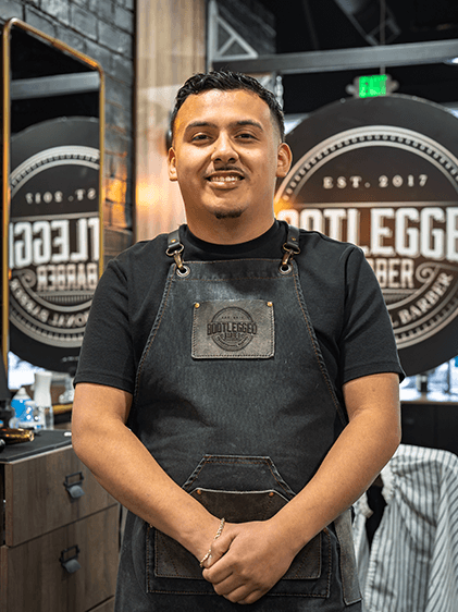 Josias, barber at Bootlegged Barber